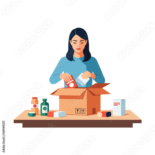 Woman packing a cardboard box with various food items on a table.