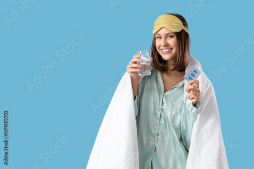 Young woman in pajamas with...