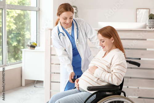 Young pregnant woman in whe...