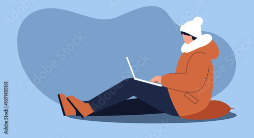 Person in winter jacket and beanie using a laptop while sitting. Concept of remote work, online learning, or cozy digital lifestyle.