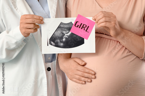 Young pregnant woman and do...