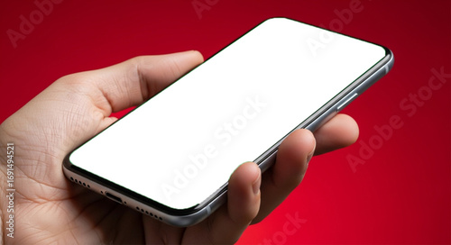 Hand holding a smartphone with a transparent screen and a colorful background. Ideal for digital banking, online finance, money transfers, investment apps, cryptocurrencies, mobile payments, and more.
