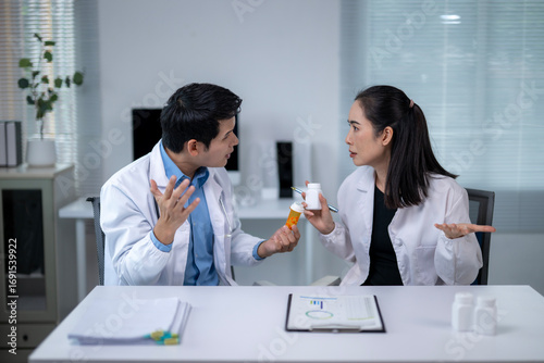 Doctors having a discussion about pills, arguing about medication in the hospital