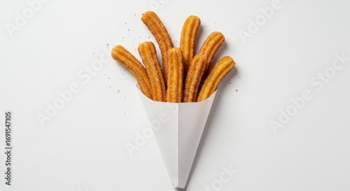 Golden Churros in White Paper Cone with Sugar Sprinkles