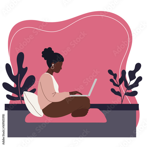 Young Black woman working remotely on laptop in a comfortable home setting. Represents freelancing, online education, or modern lifestyle productivity.