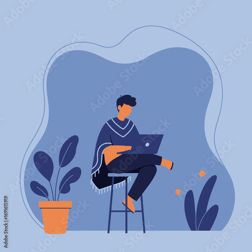 Young man in a poncho diligently uses his laptop in a relaxed, modern setting. Perfect for remote work, freelancing, online education, or a digital lifestyle concept.