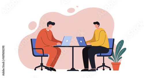 Two people working on laptops at a table, representing collaboration, productivity, and modern business. Ideal for remote work, teamwork, and office concepts.