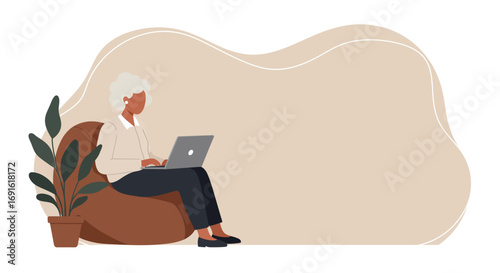 Senior woman comfortably uses laptop at home. Modern digital lifestyle, remote work, or online education concept. Ideal for themes of active retirement and technology.