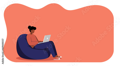 Person focused on laptop, comfortably seated on a bean bag. Represents remote work, online learning, digital lifestyle, and modern productivity with flexibility.
