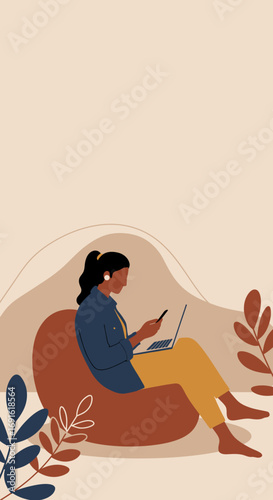 Woman working remotely from a comfy beanbag chair, multitasking with laptop and smartphone in a relaxed home setting. Modern lifestyle and flexible work concept.