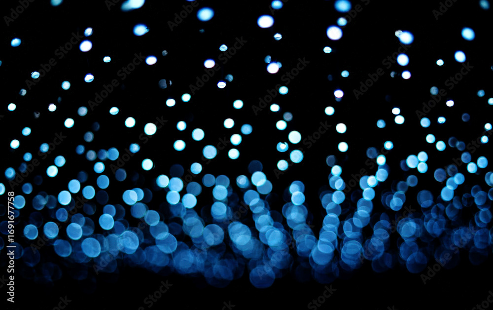 Fototapeta premium Abstract blue light spots creating a mesmerizing visual effect