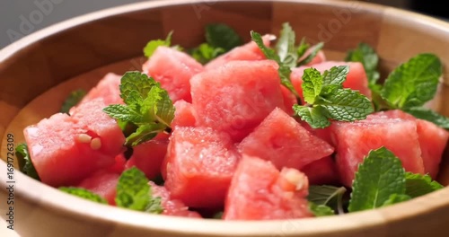 Fresh watermelon cubes garnished with mint leaves