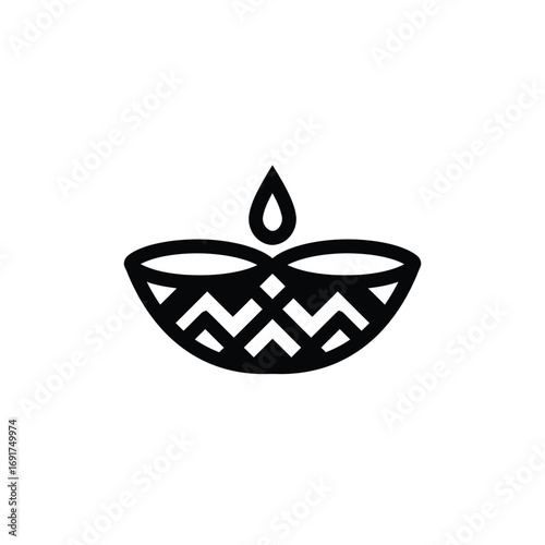 Black line art diya with flame on white lamp wick