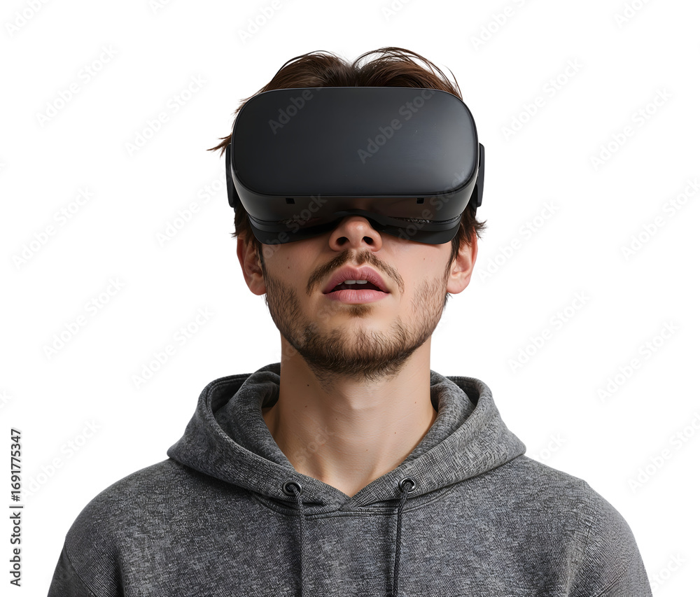 Fototapeta premium Young man wearing virtual reality headset experiencing immersive technology in casual hoodie on the transparent background