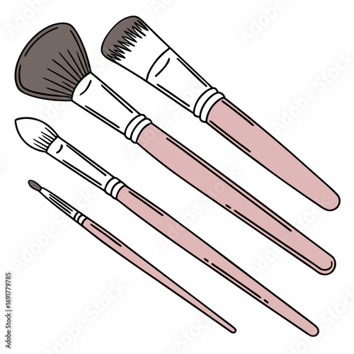 Assortment of four pink and brown makeup brushes on white background Keywords: makeup brushes, makeup