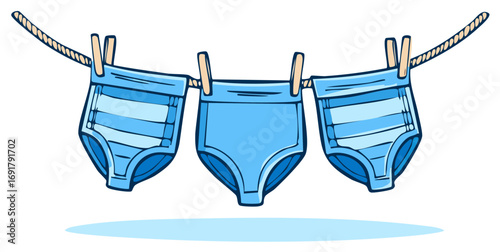 Three blue striped children's briefs hanging on a clothesline with clothespins