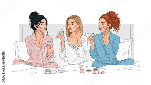 Three young women in pajamas sitting on a bed sharing beauty products and talking during a relaxed slumber party or sleepover event