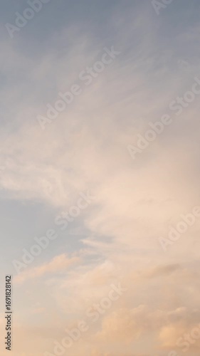 Clouds in Orange Sky at Sunset (Vertical, Timelapse)