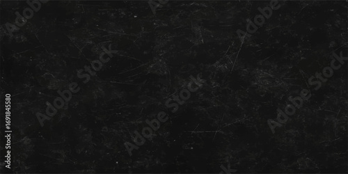 An aged black paper texture with a grunge wall pattern and a blank vintage chalkboard surface