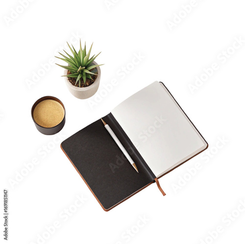 Open notebook with pen plant and coffee desk