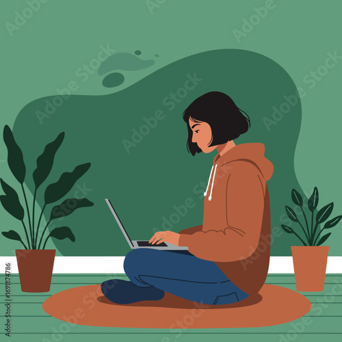 Focused young woman working remotely on her laptop from a comfortable home setting, surrounded by green plants. Ideal for modern lifestyle, online education, or freelance concepts.