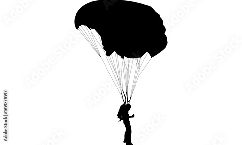 Silhouette of a skydiver with parachute deploying.