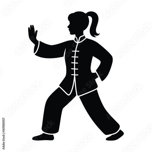 Black silhouette of a woman practicing Tai Chi in traditional clothing martial arts exercise
