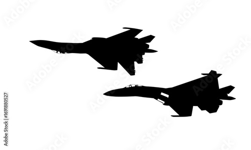 Two Sukhoi Su-27 fighter jets in silhouette.