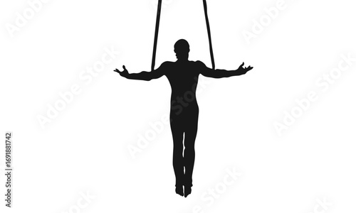 Silhouette of a male gymnast on rings, performing a controlled strength exercise, arms outstretched
