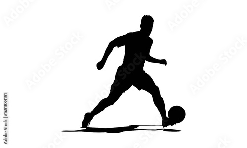 Silhouette of a soccer player dribbling the ball.