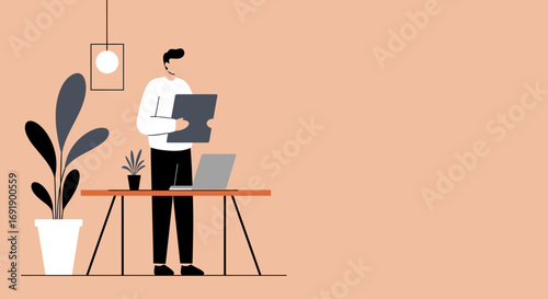 Focused professional man reviewing documents at a modern standing desk with a laptop in a minimalist home office or workspace. Ideal for business, productivity, and remote work concepts.