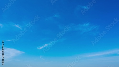 Stunning Panoramic View of a Bright Blue Sky with Wispy Clouds  