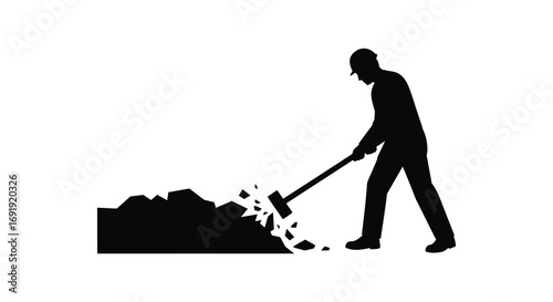 a man shoveling debris into a pile outside