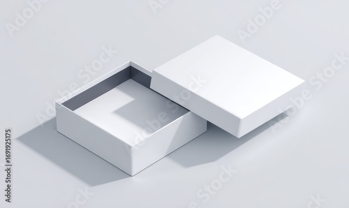 Opened white square box on light gray surface