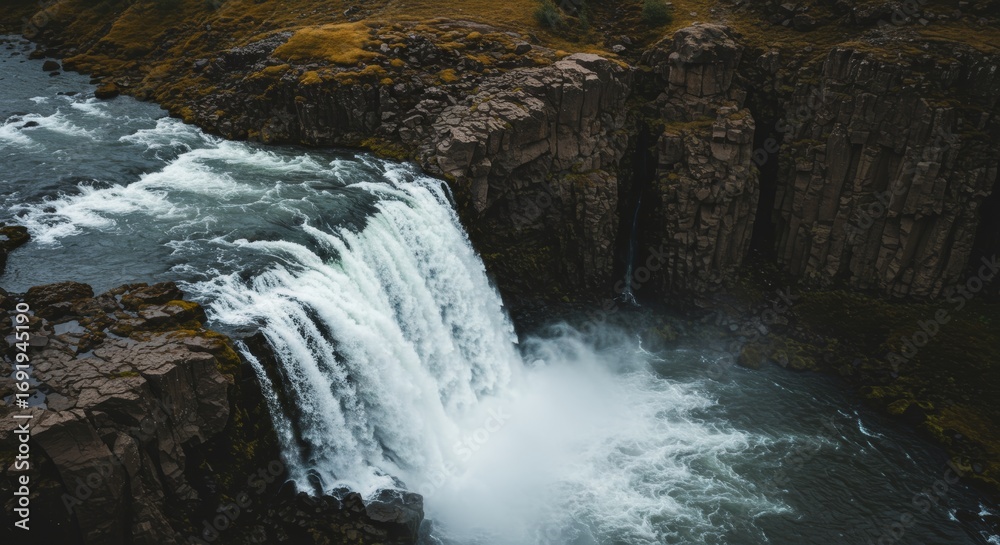 Fototapeta premium Aerial view of the majestic Dettifoss waterfall cascading through Iceland landscape