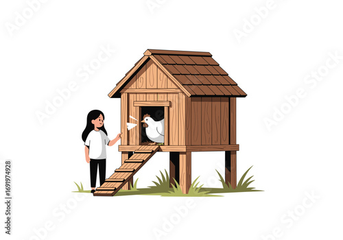 Young person feeding a chicken at its wooden coop in a grassy field
