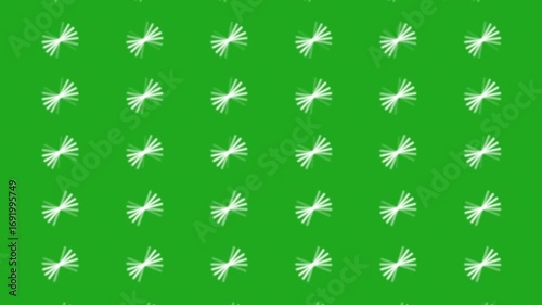 Animation of a repetitive grid pattern of abstract white starbursts on a bright green background