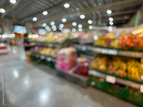 Wallpaper Mural blurred image of a grocery store produce section, showcasing a variety of fresh fruits and vegetables on the shelves. Torontodigital.ca