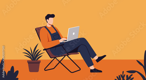 Young man focused on his laptop while relaxing in a chair, illustrating the flexibility of remote work and digital nomad lifestyle.