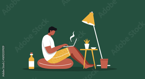 Productive man working on his laptop in a comfortable home environment, illustrating flexible work arrangements and modern lifestyle.