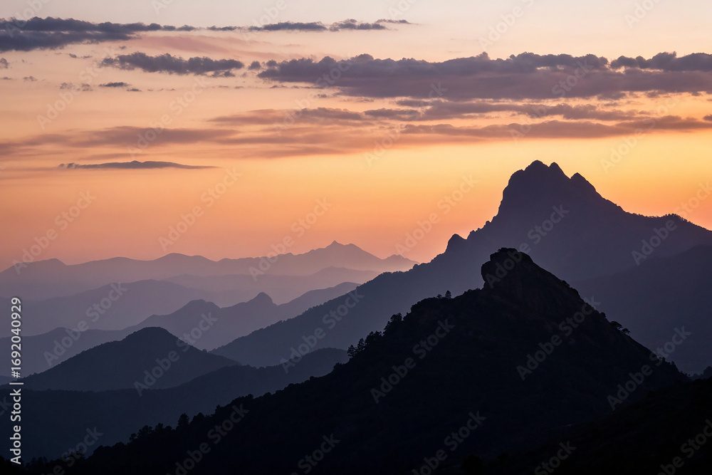 Obraz premium Mountain ranges at sunset silhouette twilight