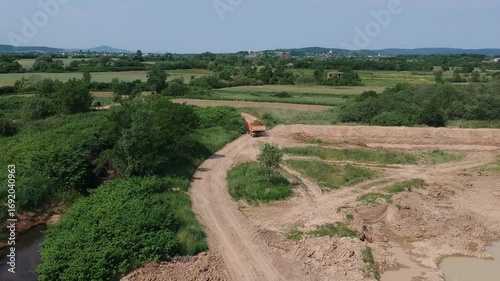 Dirt Road in Countryside with Dump Truck