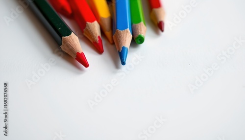 A collection of colored pencils neatly arranged on a surface.