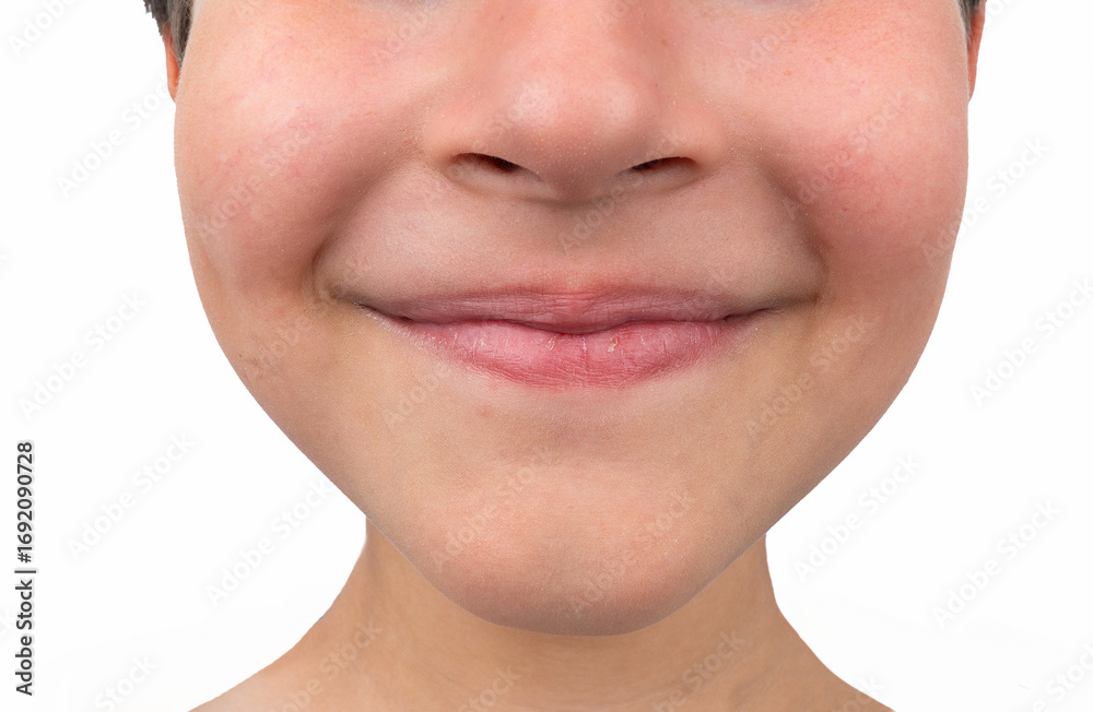 Obraz premium Cropped image of a child's mouth smiling.