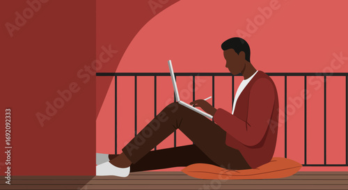 Focused man working remotely on a laptop with a stylus on a balcony, embodying flexible work, entrepreneurship, and modern digital lifestyle.