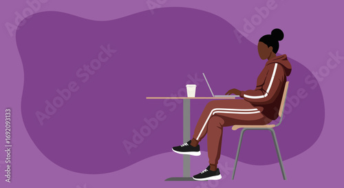 Focused young woman working remotely on her laptop at a table, enjoying a coffee. Represents productivity, freelance, and modern casual lifestyle.