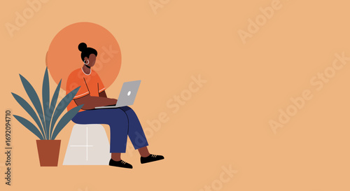 A focused person sits and works on a laptop in a modern, minimalist setting. Ideal for themes of remote work, online learning, and digital lifestyle.