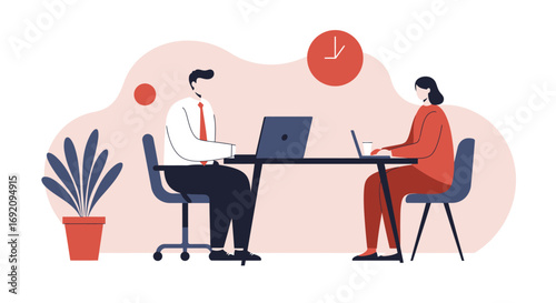 Two professionals working on laptops at a desk, representing productivity, teamwork, and modern business collaboration in an office environment.