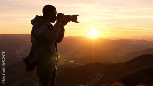 Cinematic Golden Hour Silhouette of Photographer on Hilltop with Telephoto Lens