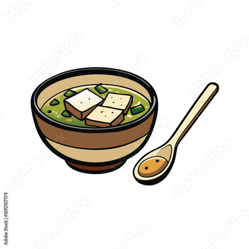 Delicious miso soup with tofu and seaweed served in a bowl with a spoon